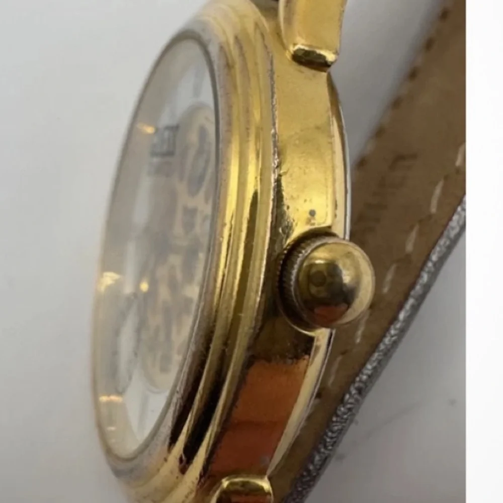 Guess Gold and Silver Quartz skeleton watch